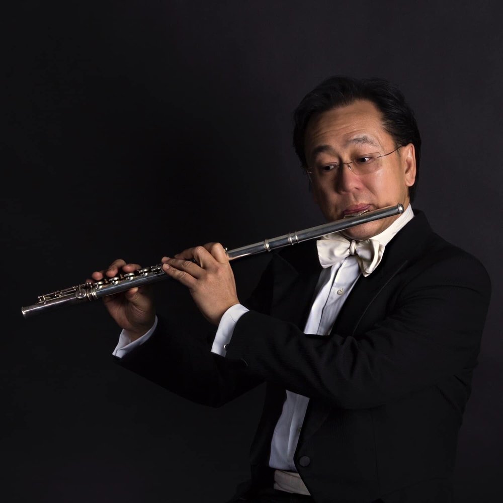 An iconic photo of Joel Tse, playing with his own flute.