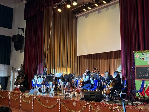 A scene of students performing in the concert.