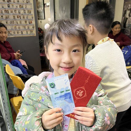 She's happy for earning $20 from her CNY pocket!
