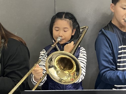 One of the students is so focused on this concert rehearsal.