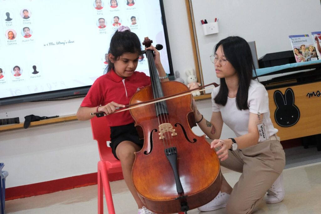 Sophie is having a cello with one of her students.