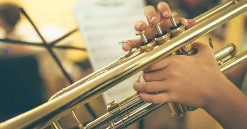 A group of students is performing with their own trumpets!