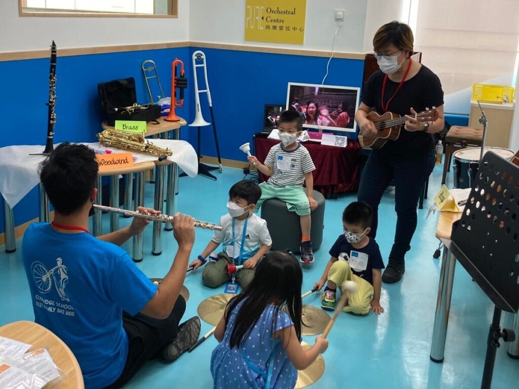 PURE offers different music programs in other schools. Here is a group of young children having lesson with Nigel and Lorraine.