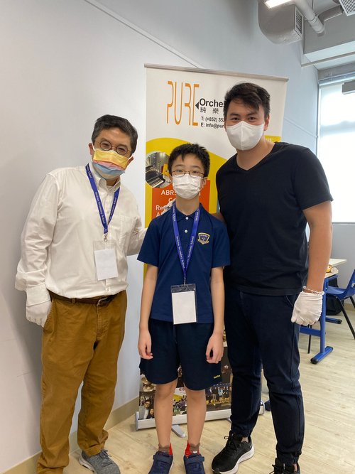 A group photo with Ringo, Hugo and a fellow outstanding student.